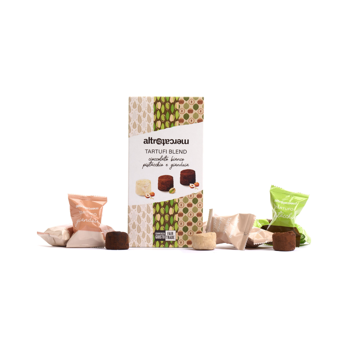 A box of assorted chocolate and nut truffles with several individually wrapped truffles displayed in front. The packaging has a patterned design and indicates the product is made with Fair Trade ingredients.