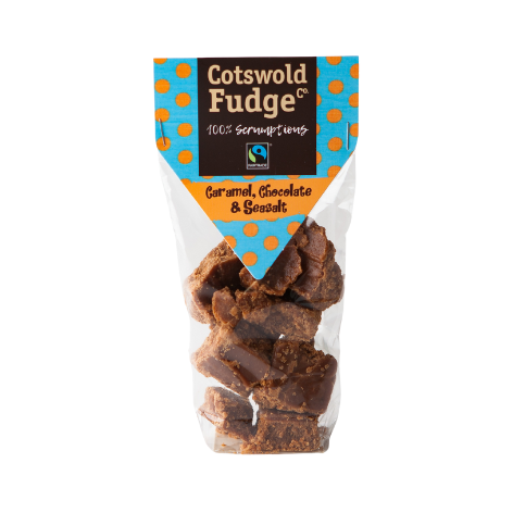 A bag of 100% scrumptious Fairtrade Caramel, Chocolate and Seasalt Fudge made by Cotswold Fudge Co. The bag is transparent with chunks of fudge on display.