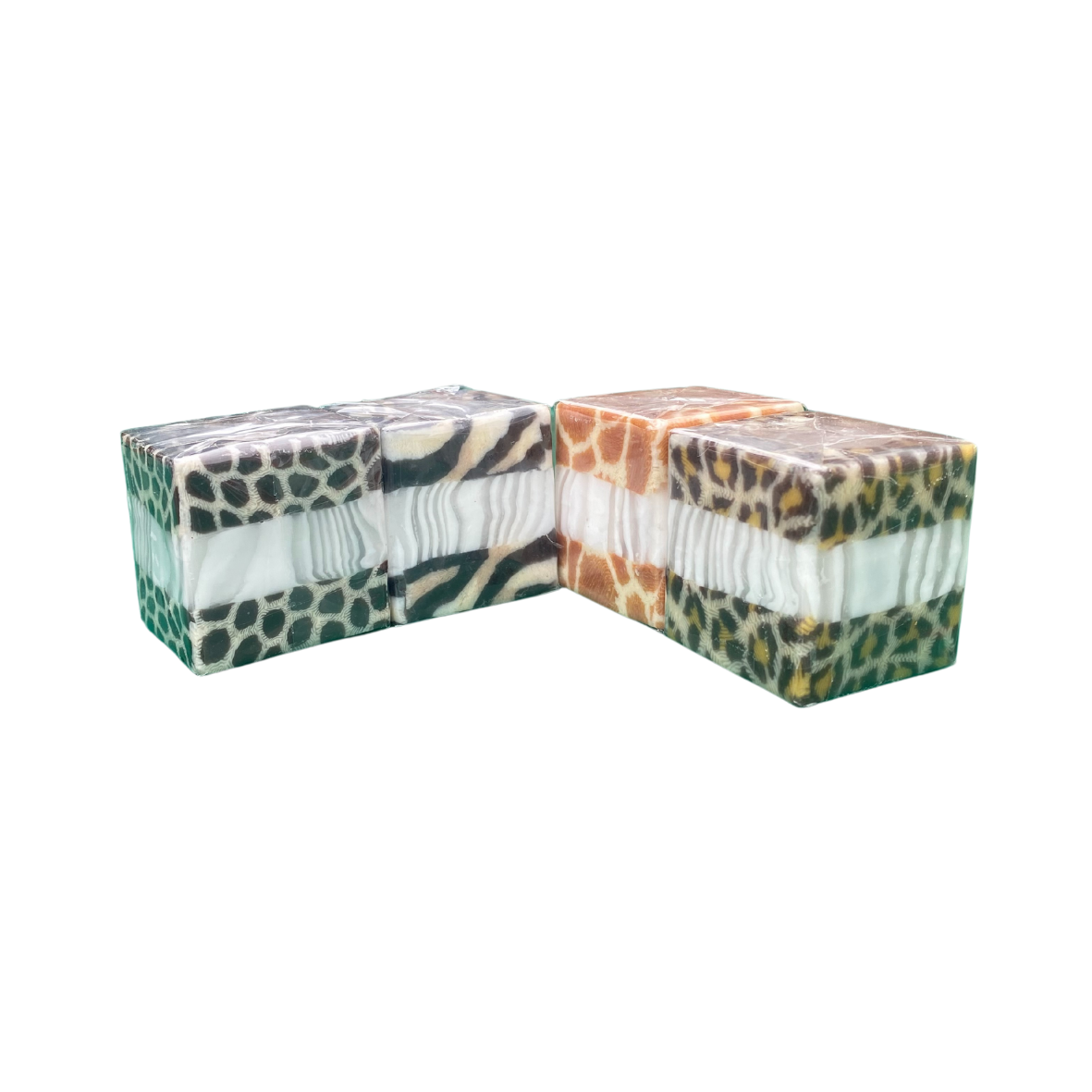 A pack of four mini cube Swazi candles with different animal designs on them.