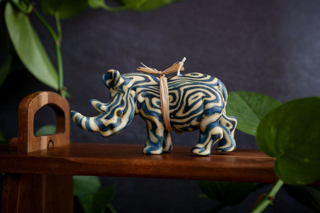Decorative rhino candle on a dark background