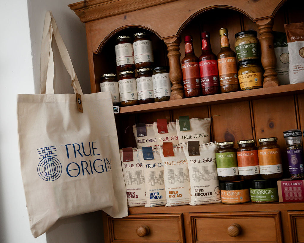 Range of True Origin products on a pine unit.