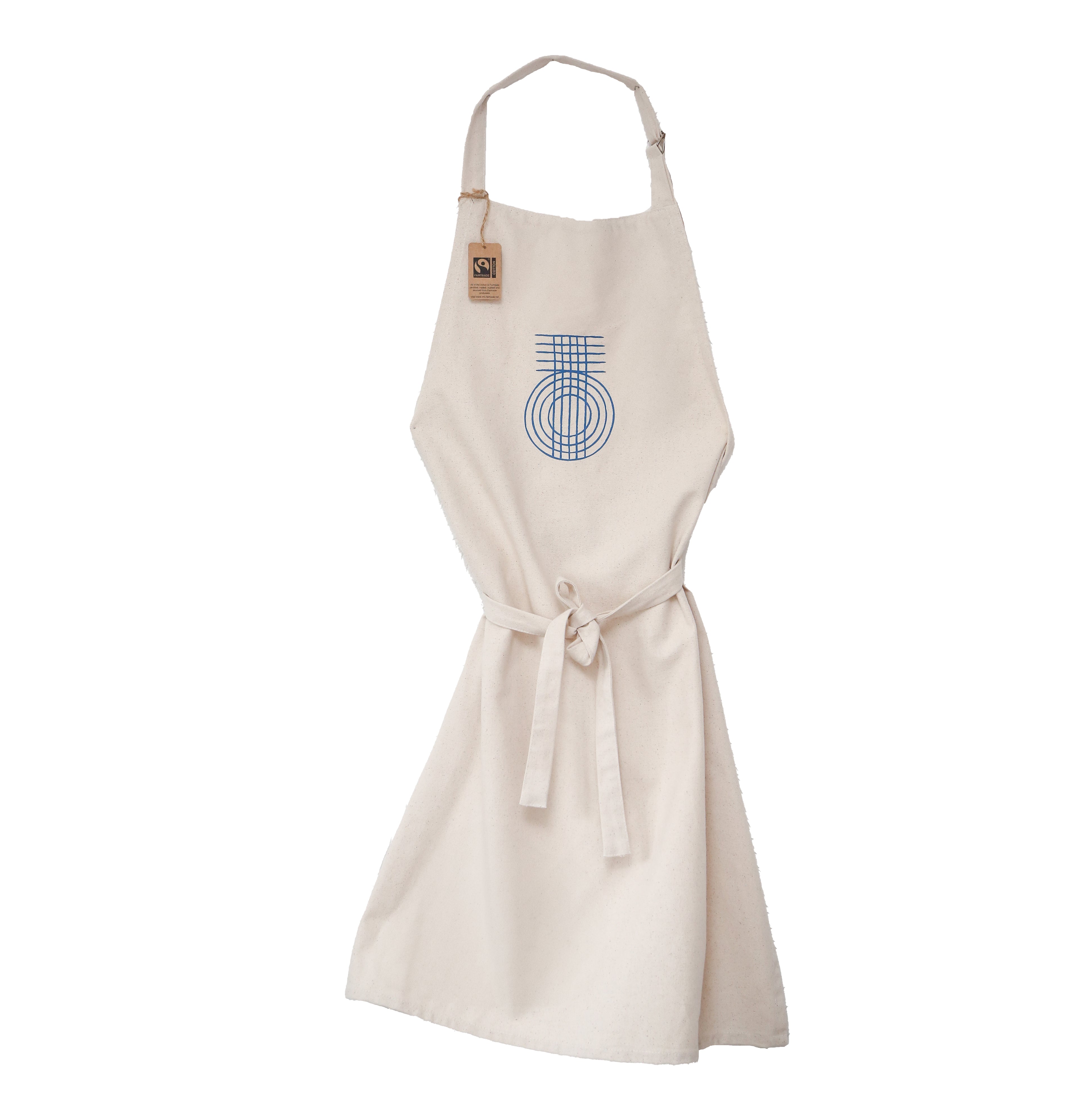 A beige apron made with Fairtrade cotton with the True Origin 'TO' weave symbol on the front.