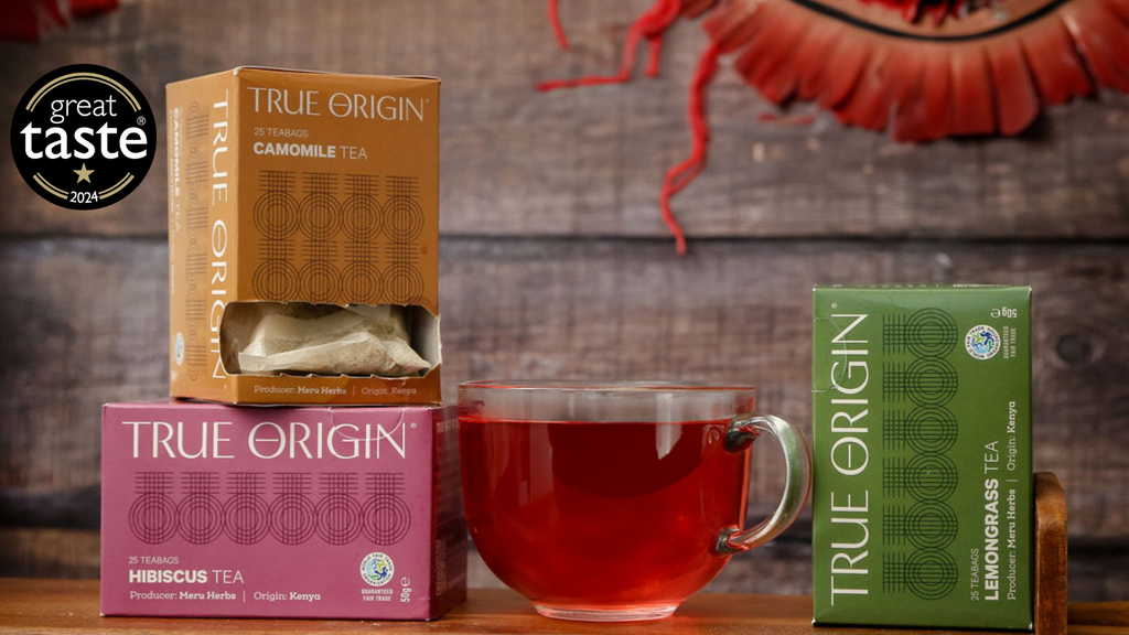 Cartons of Camomile tea, Hibiscus tea and Lemongrass tea with a cup of tea in the middle and a Great Taste award 2024.