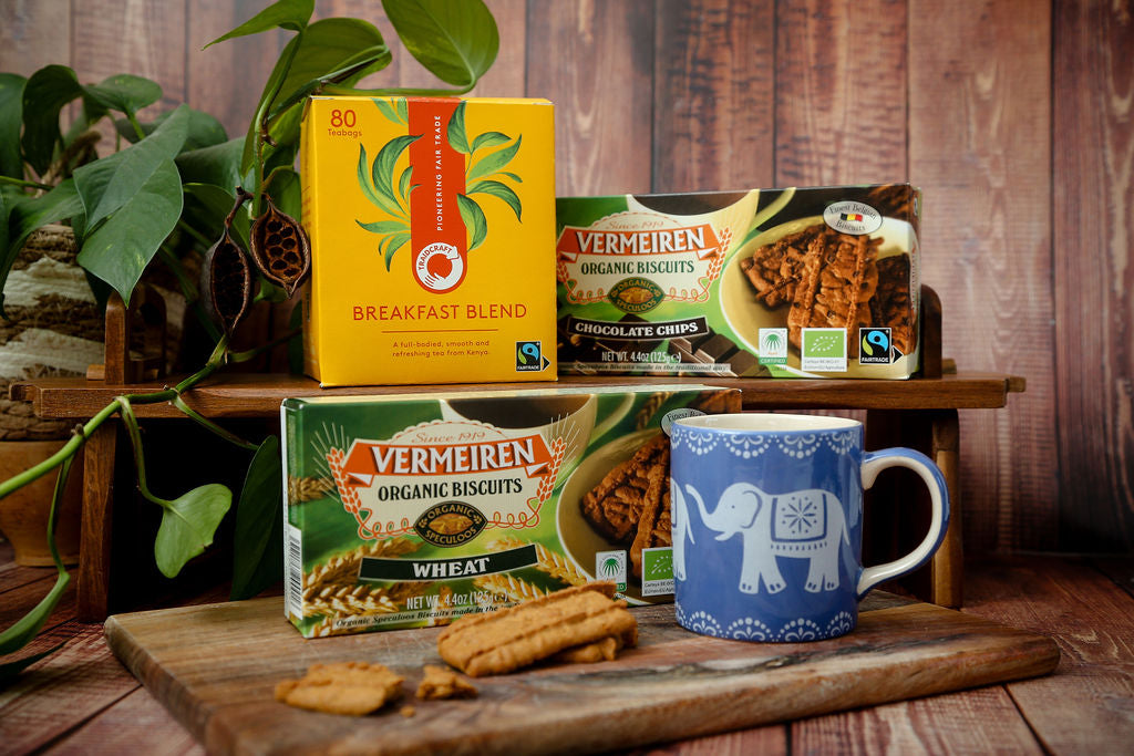 Traidcraft Fairtrade Tea, Vermeiren Organic Biscuits (both wheat and chocolate chip are available) and a blue mug with a white elephant design.