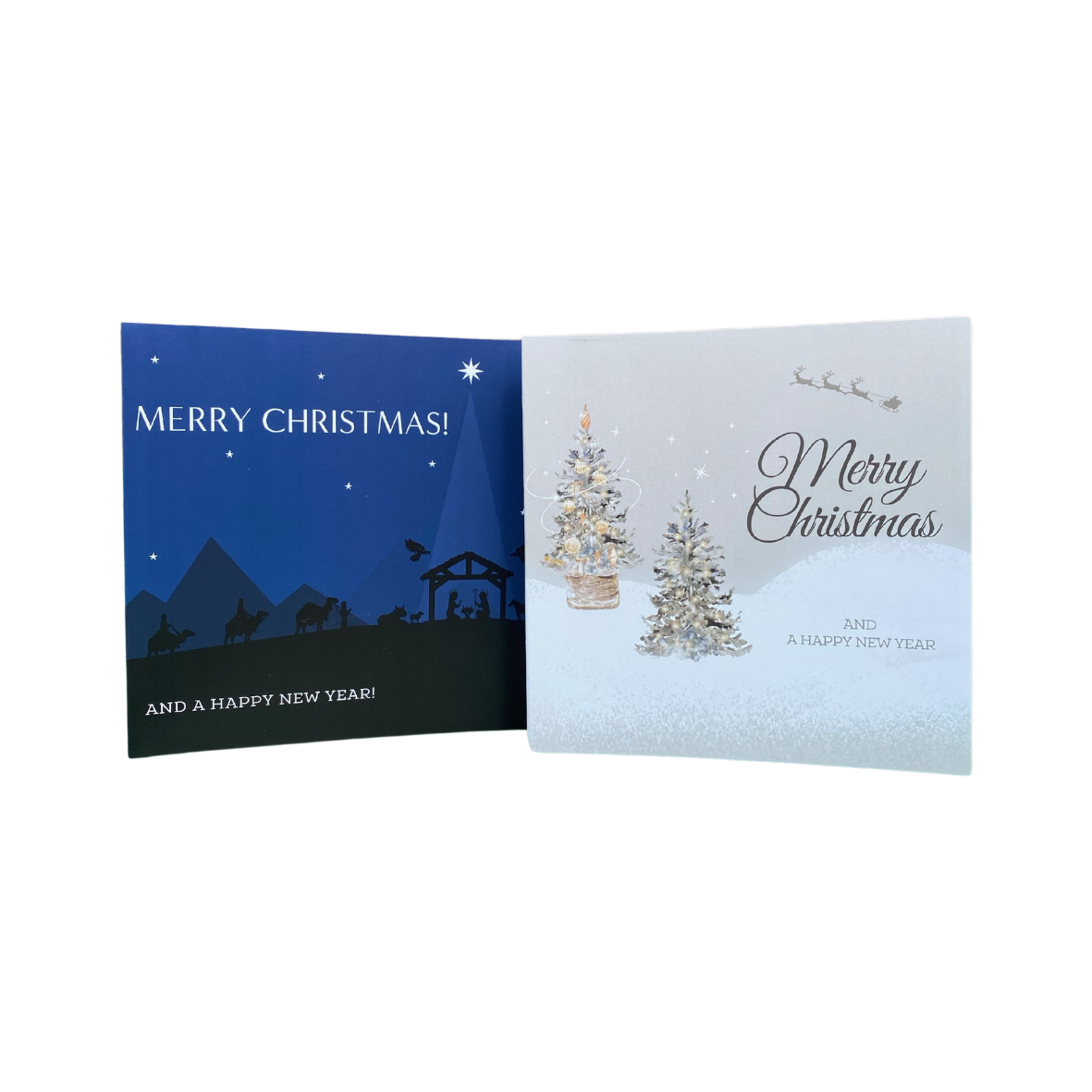 Two Christmas cards displayed side by side. The card on the left features a blue background with a nativity scene and the card on the right has a white background with a silver and gold Christmas tree.  They both say Merry Christmas.