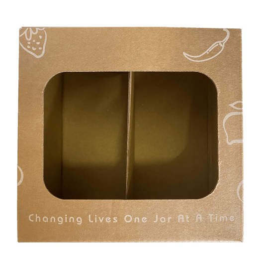 Brown cardboard box with a window displaying a jar, featuring text 'Changing Lives One Jar At A Time'.