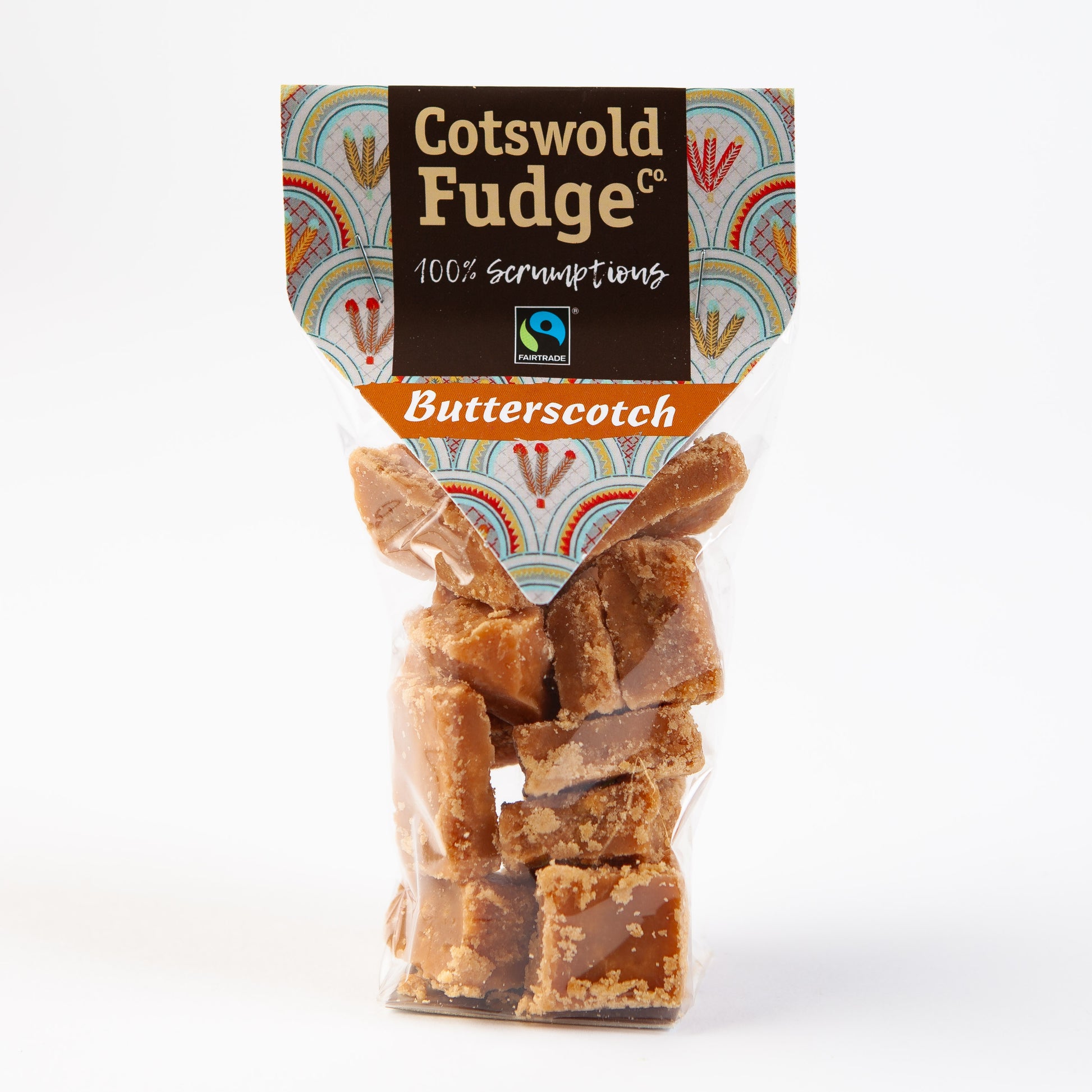 A bag of 100% scrumptious Fairtrade Butterscotch Fudge made by Cotswold Fudge Co. The bag is transparent with chunks of fudge on display.