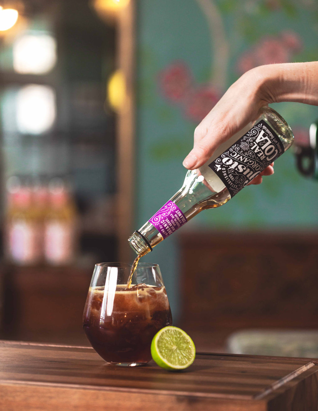 Gusto Real Cola being poured into a glass