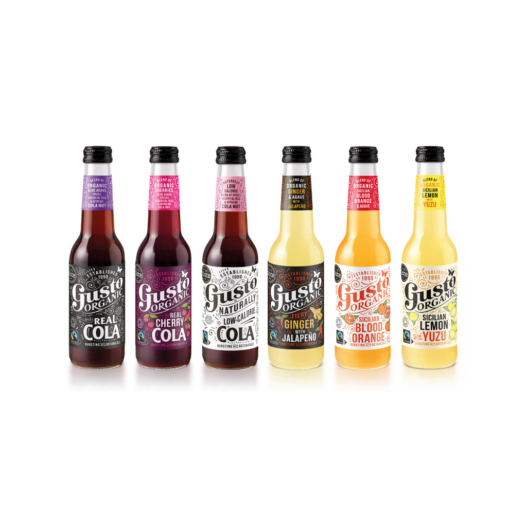 A selection of six bottles of Gusto branded drinks, showcasing various flavors such as cola and blood orange, arranged in a row.