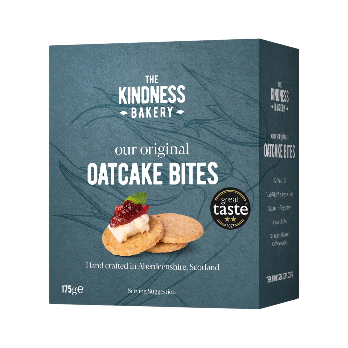 Packaging for The Kindness Bakery's Original Oatcake Bites. The box is colored in dark blue with images of the oatcakes and a piece of cheese with a jam on top.