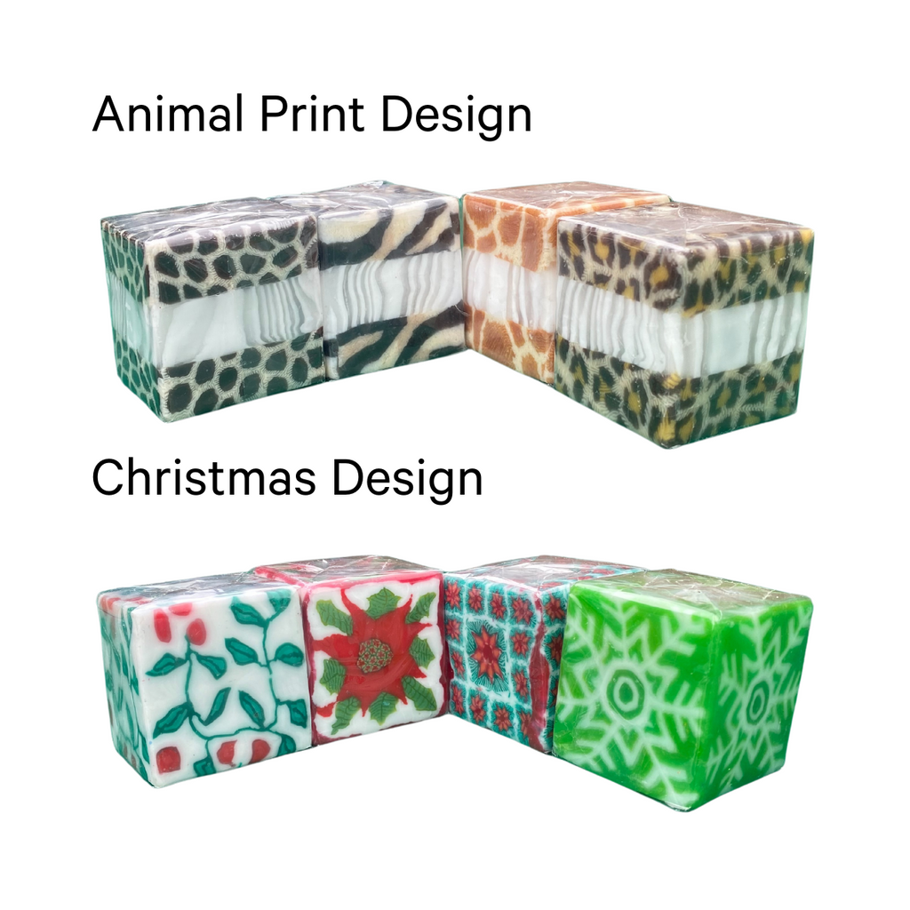 Two lots of four square candles with different designs. The top set has an animal print design, the bottom set has a Christmas-themed design with snowflakes, poinsettia and holly.