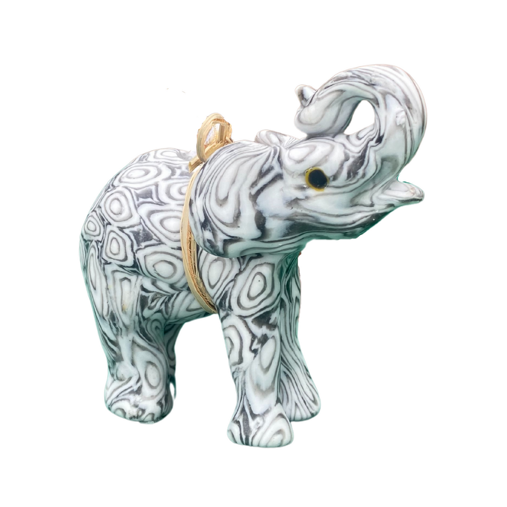 A hand made African elephant with a black and white congo design.