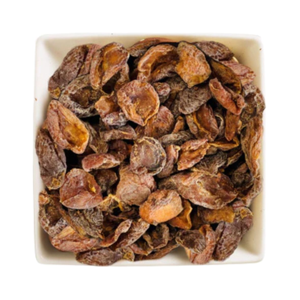Dried apricots in a white bowl on a white background