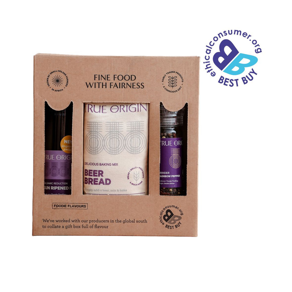 A True Origin 'Fine Food with Fairness' gift box set, shown in its brown kraft packaging with a Best Buy badge in the top right corner.