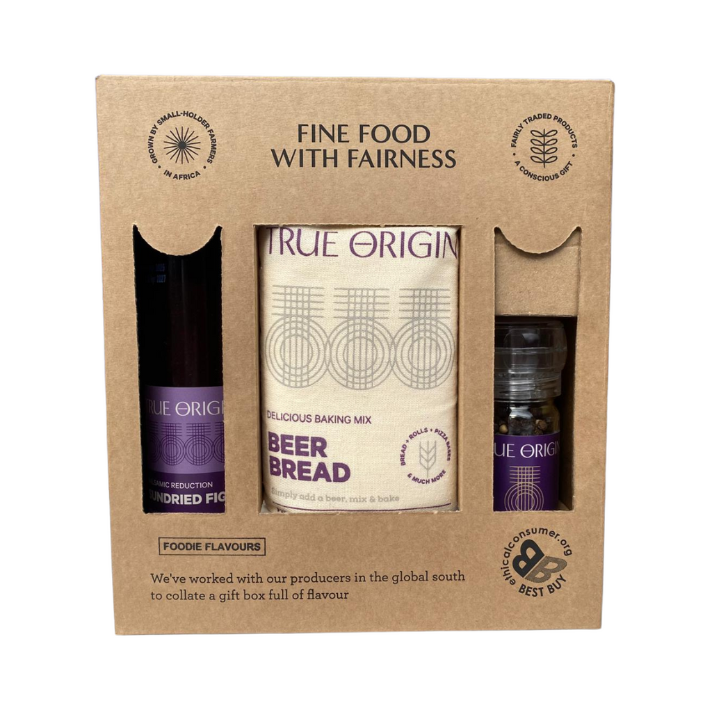 Gift set with 'True Origin' beer bread, balsamic reduction and flavoured pepper within a cardboard box.
