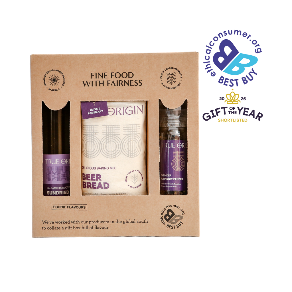 Gift set with True Origin products in a cardboard box, featuring ethical consumer award, and Gift of the Year 2026 award logos on a white background.