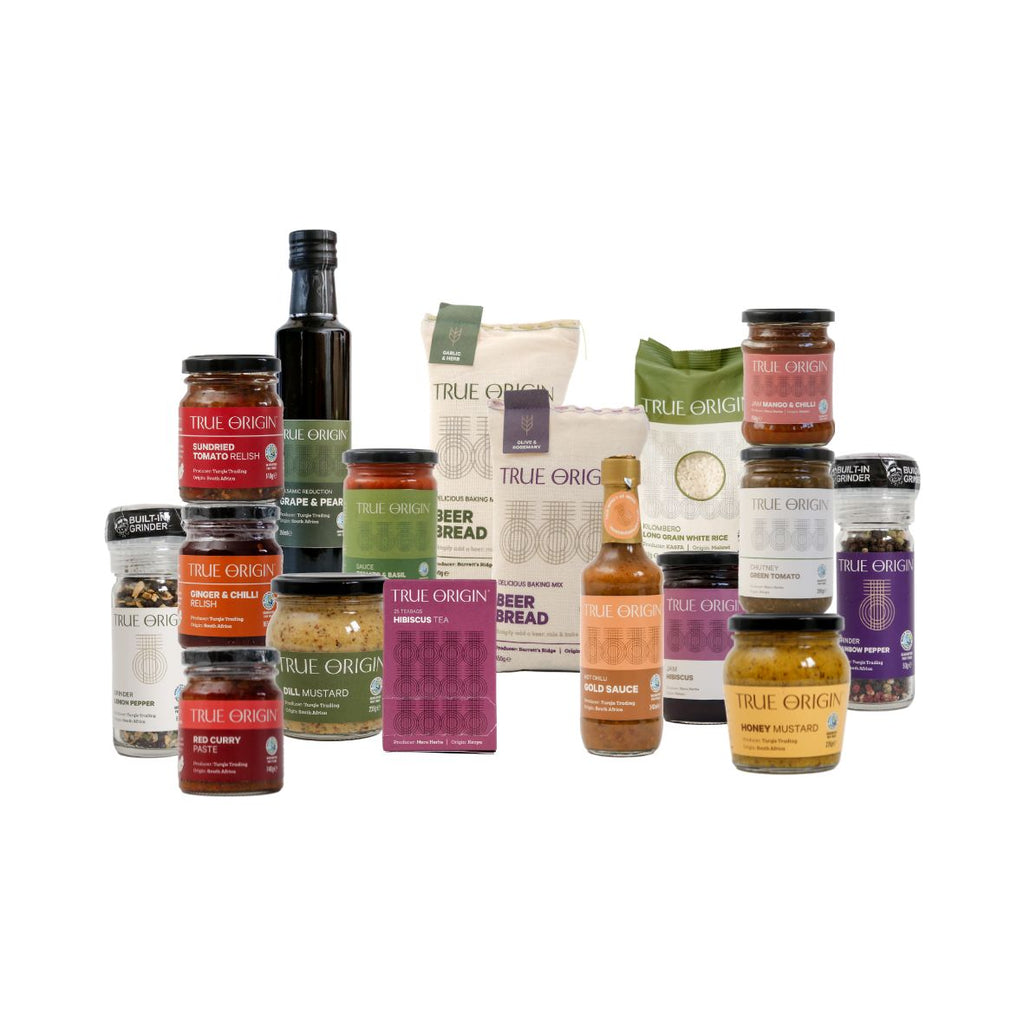 Collection of various food and beverage products on a white background.  These  products will be in the Foodie Selection Hamper.