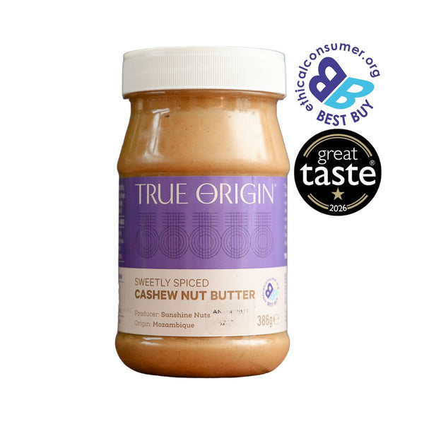 A jar of True Origin Sweetly Spiced Cashew Nut Butter on a white background, featuring a purple and white label. Two award badges are displayed on the top right: The Best Buy Logo and 1 star Great Taste Award 2026.