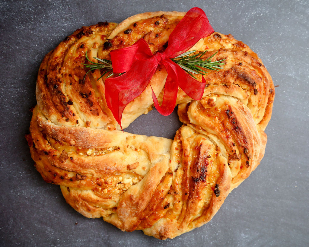 A Festive Feta Wreath made with Chilli & Garlic Beer Bread with Mango and Chilli Jam.
