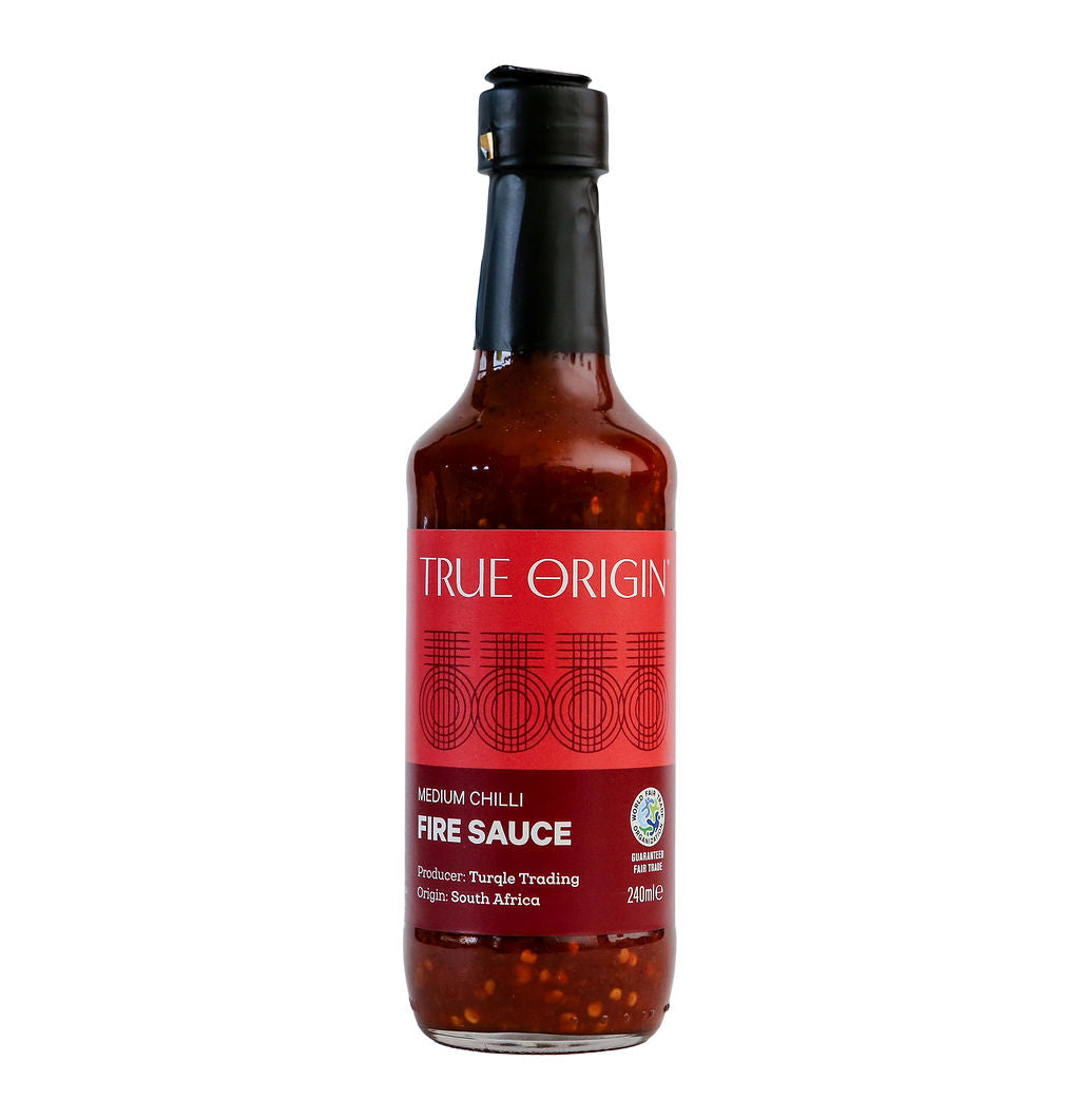 Bottle of True Origin fire sauce on a white background