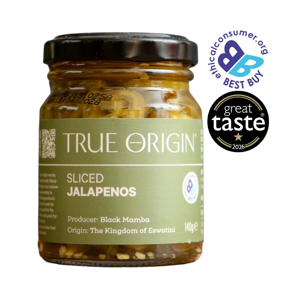 A glass jar of True Origin Sliced Jalapeños with a black lid and olive green label, shown on a white background. Two award badges are displayed on the top right: The Best Buy Logo and 1 star Great Taste Award 2026.