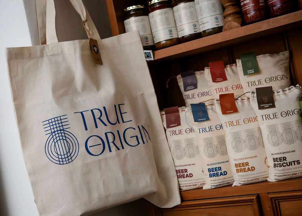 Range of True Origin products on a pine unit.