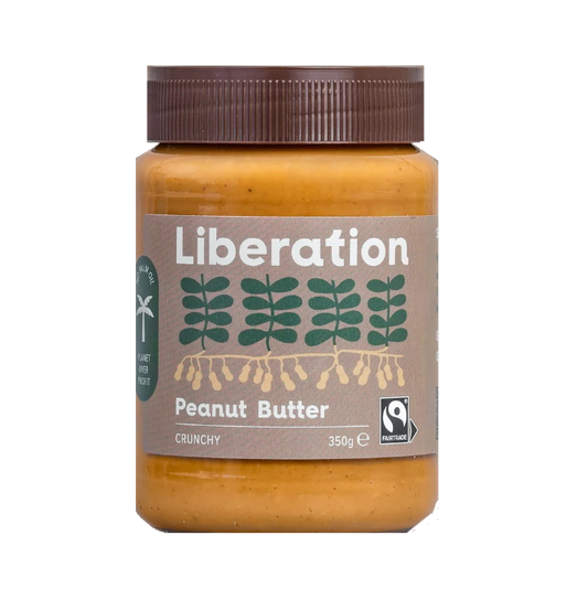 A jar of Liberation Foods Fairtrade Peanut Butter, crunchy type, with a label showing the brand name and a graphic of peanuts. The jar size is 350g.