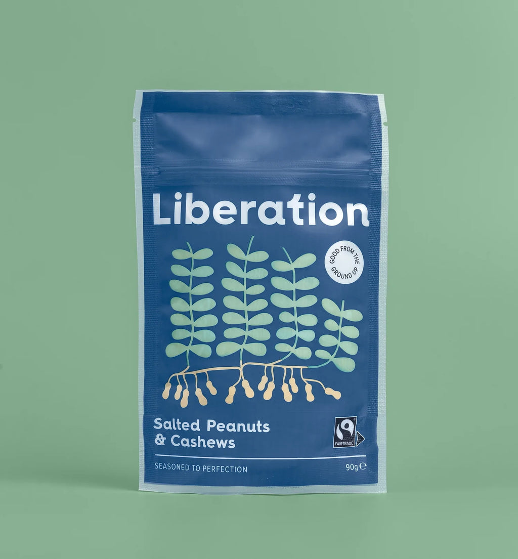 A blue bag of fair trade Liberation Foods salted peanuts and cashew nuts.