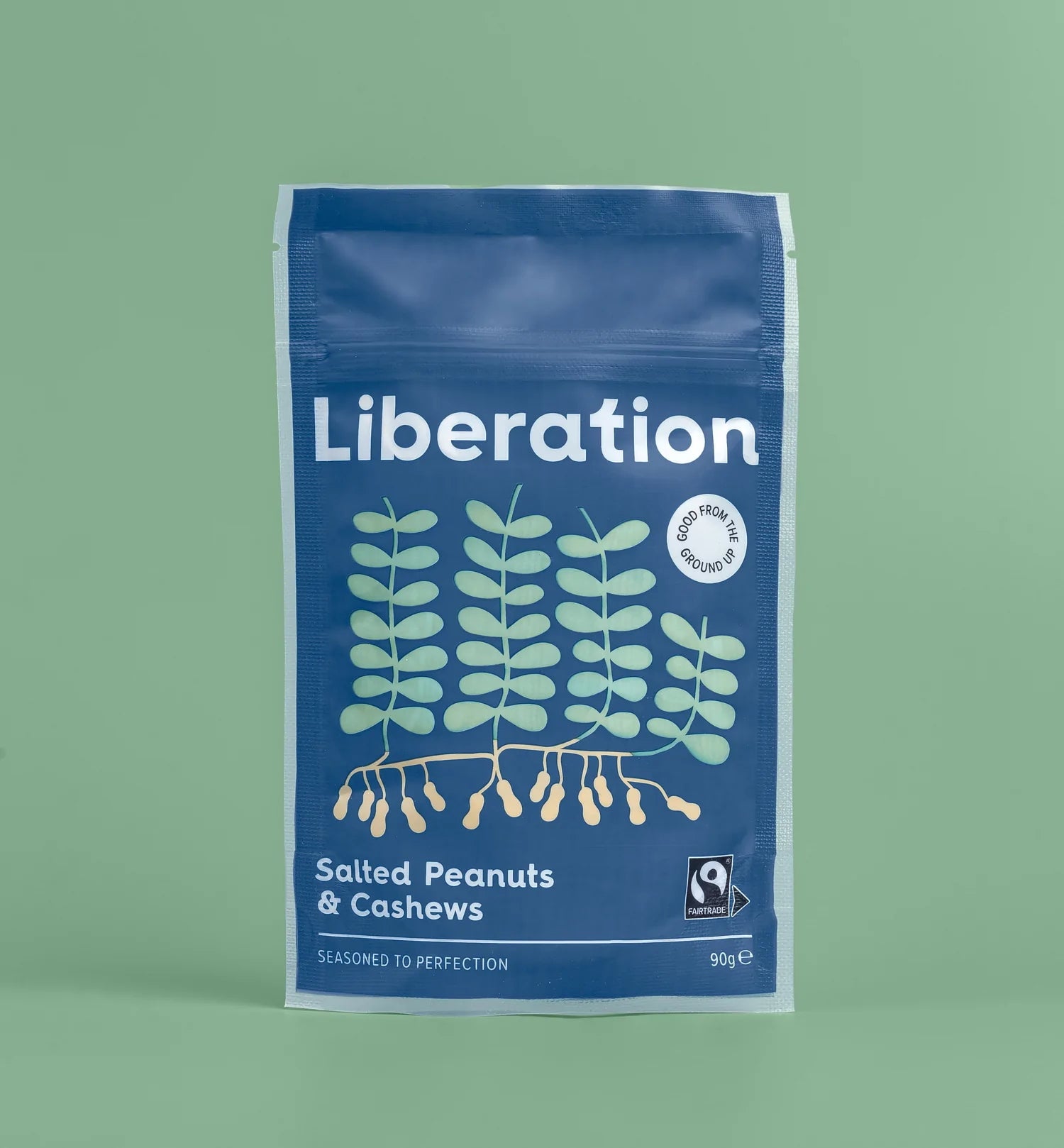 A blue bag of fair trade Liberation Foods salted peanuts and cashew nuts.