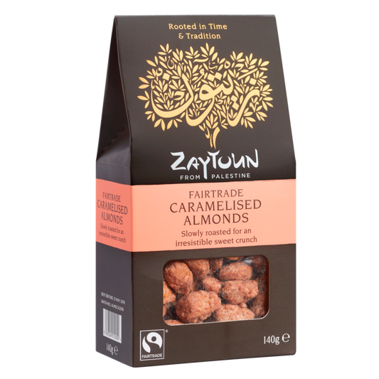 A box of Zaytoun carmelised almonds from Palestine with a window showing the almonds and the Fairtrade logo.